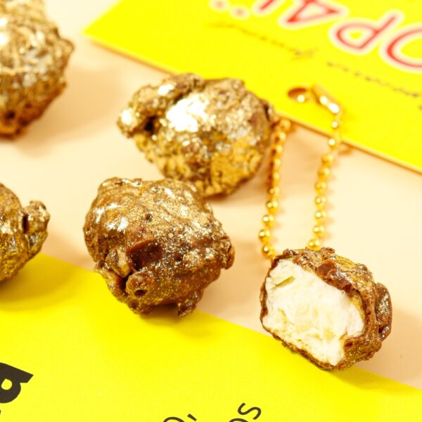 Pipoca gourmet sabor Ferrero Rocher com cobertura crocante dourada e chocolate ao leite.